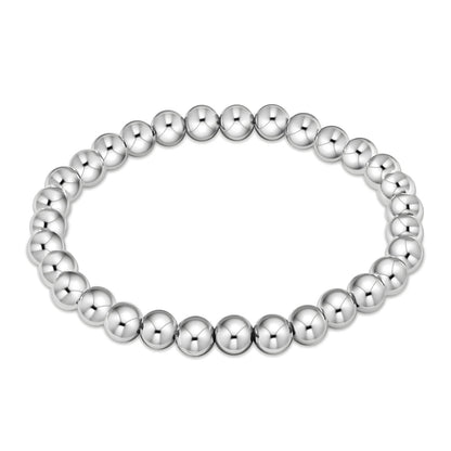 A bracelet made of stainless steel with a series of round beads.