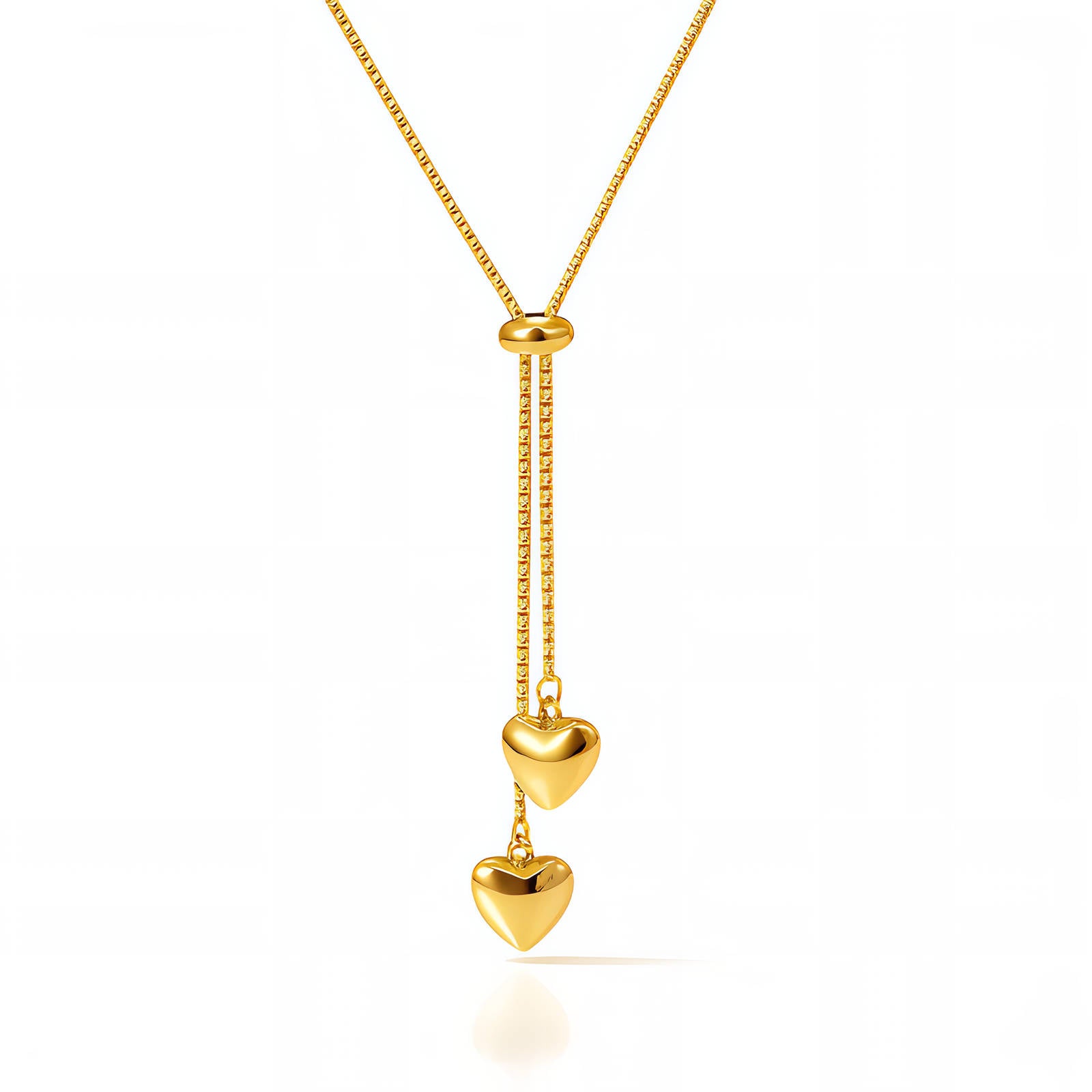 Gold necklace with heart-shaped pendants on a white background
