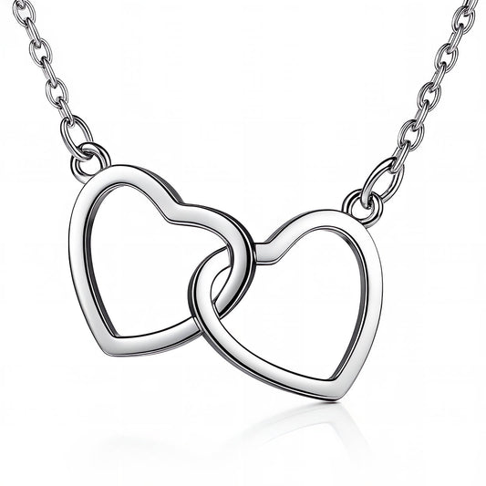 Silver necklace with interlocking heart pendants on a white background