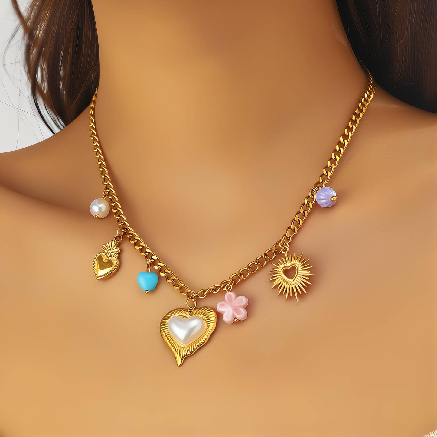 Gold necklace with heart and flower charms on a person's neck